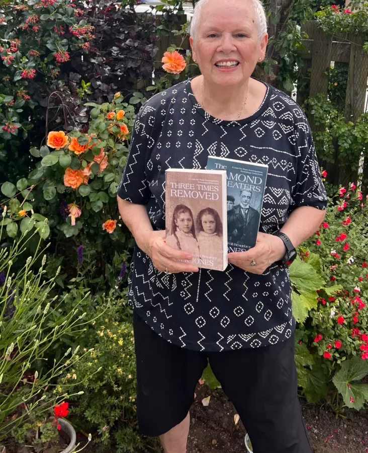 a woman holding up a book