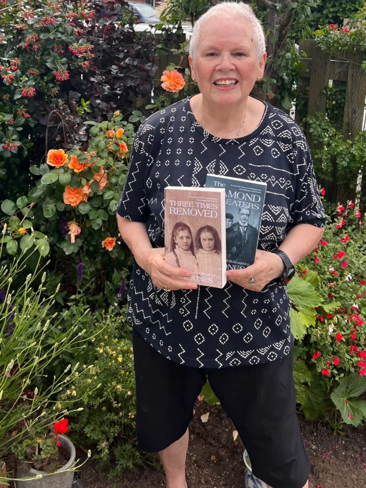 a woman holding up a book