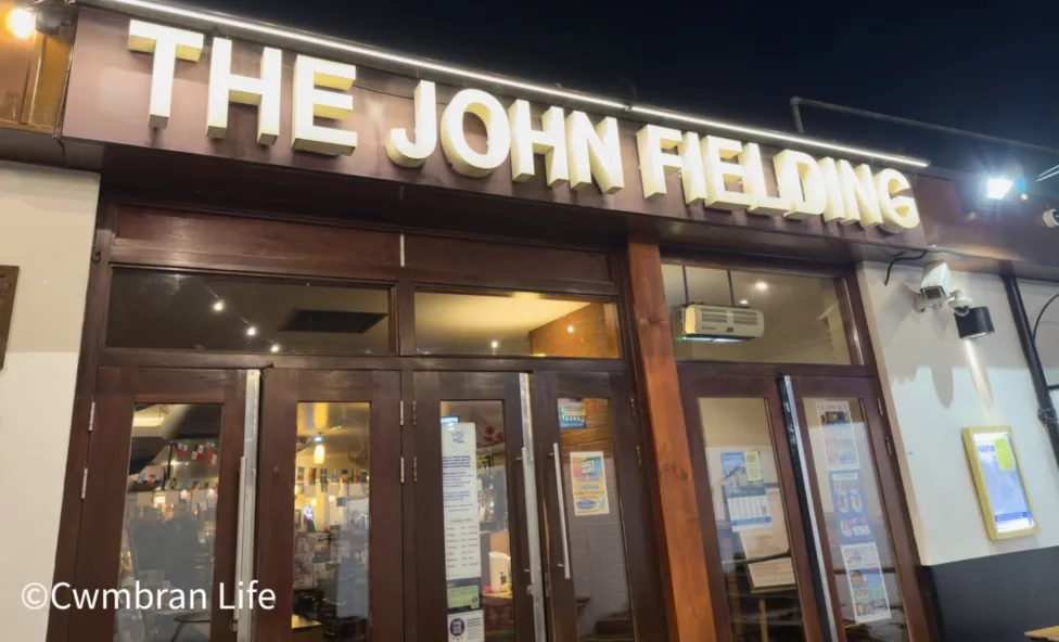 the entrance to a pub called The John Fielding