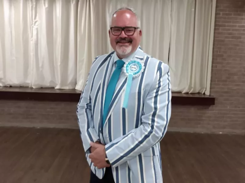 a main in a striped suit