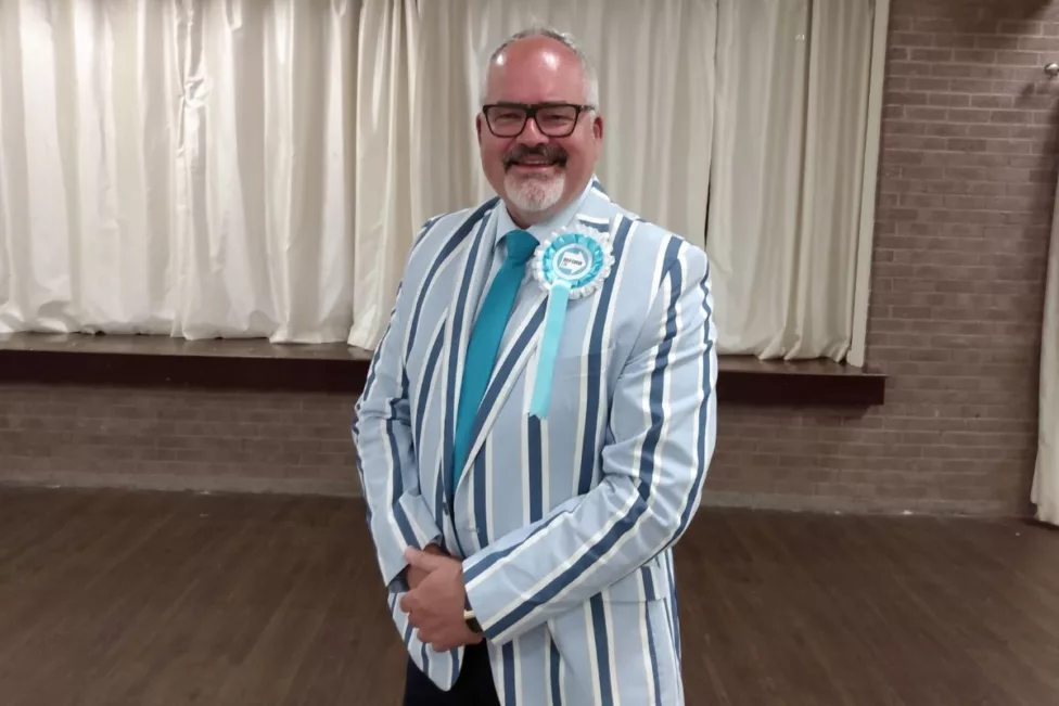 a main in a striped suit