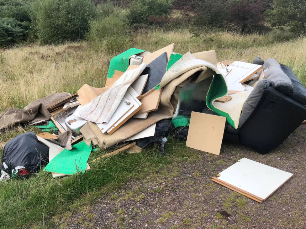 a pile of fly Tipping on grassland