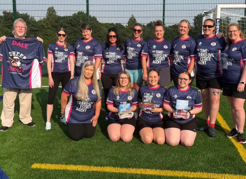 a rounders team smile for a photo