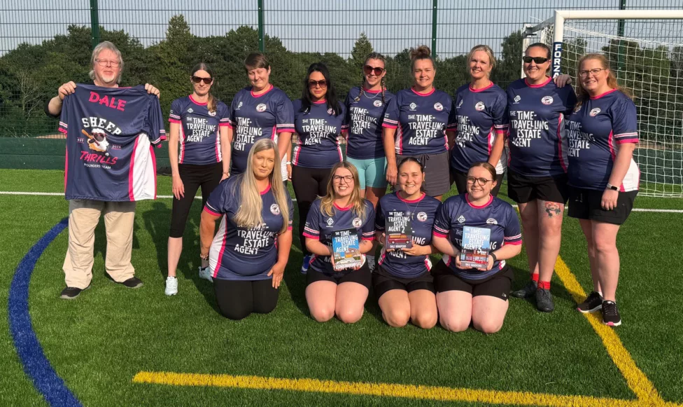 a rounders team smile for a photo