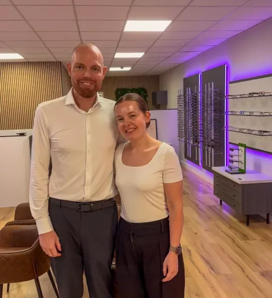a man and woman in a an opticians