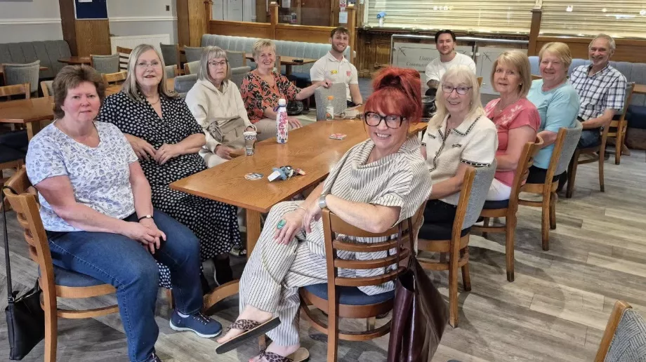 a group of men and women sat at