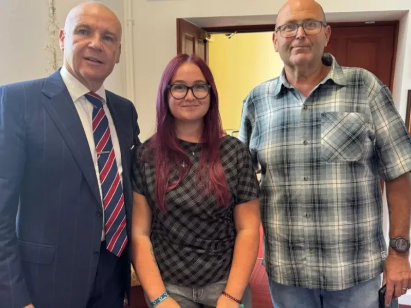 two men and a woman