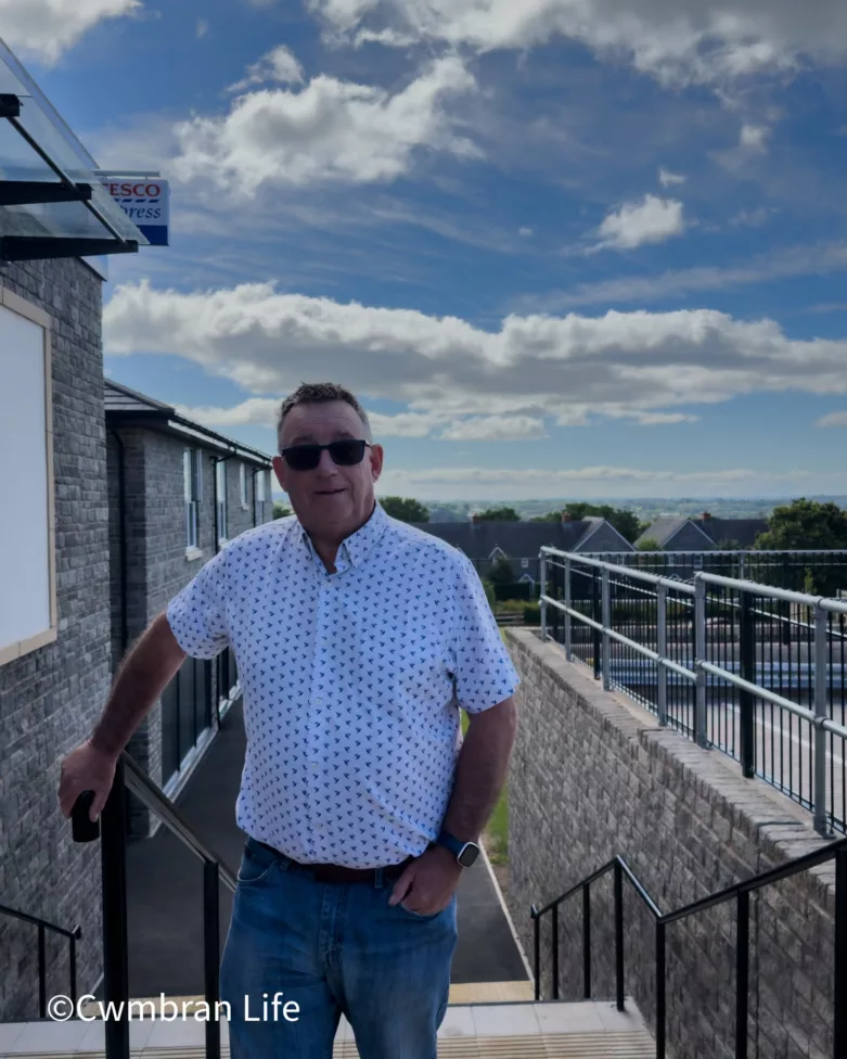 a man stood outside by some steps