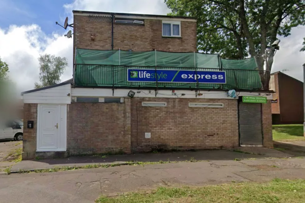 a boarded up shop