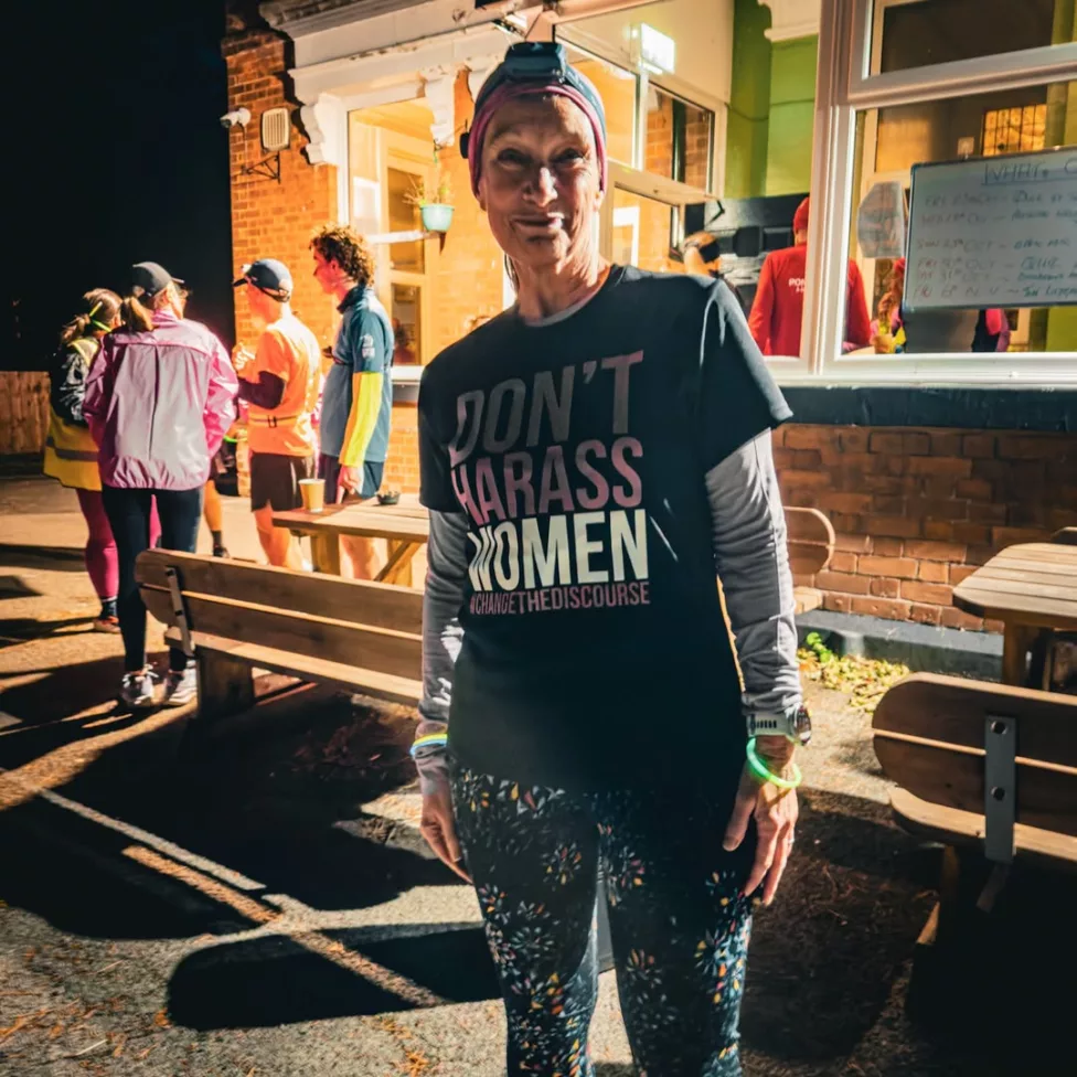 a woman wearing a t-shirt 'don't harass women'