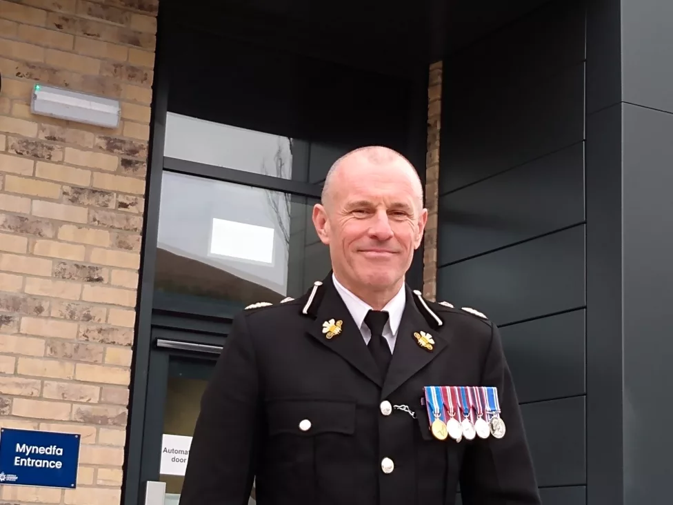 a police officer outside a station